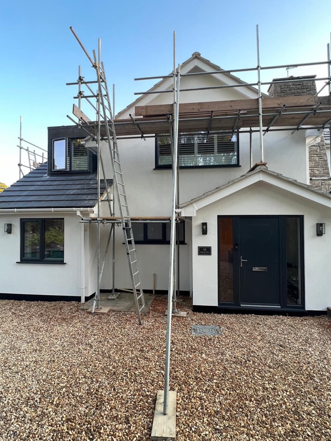 External wall insulation render being applied on scaffolding